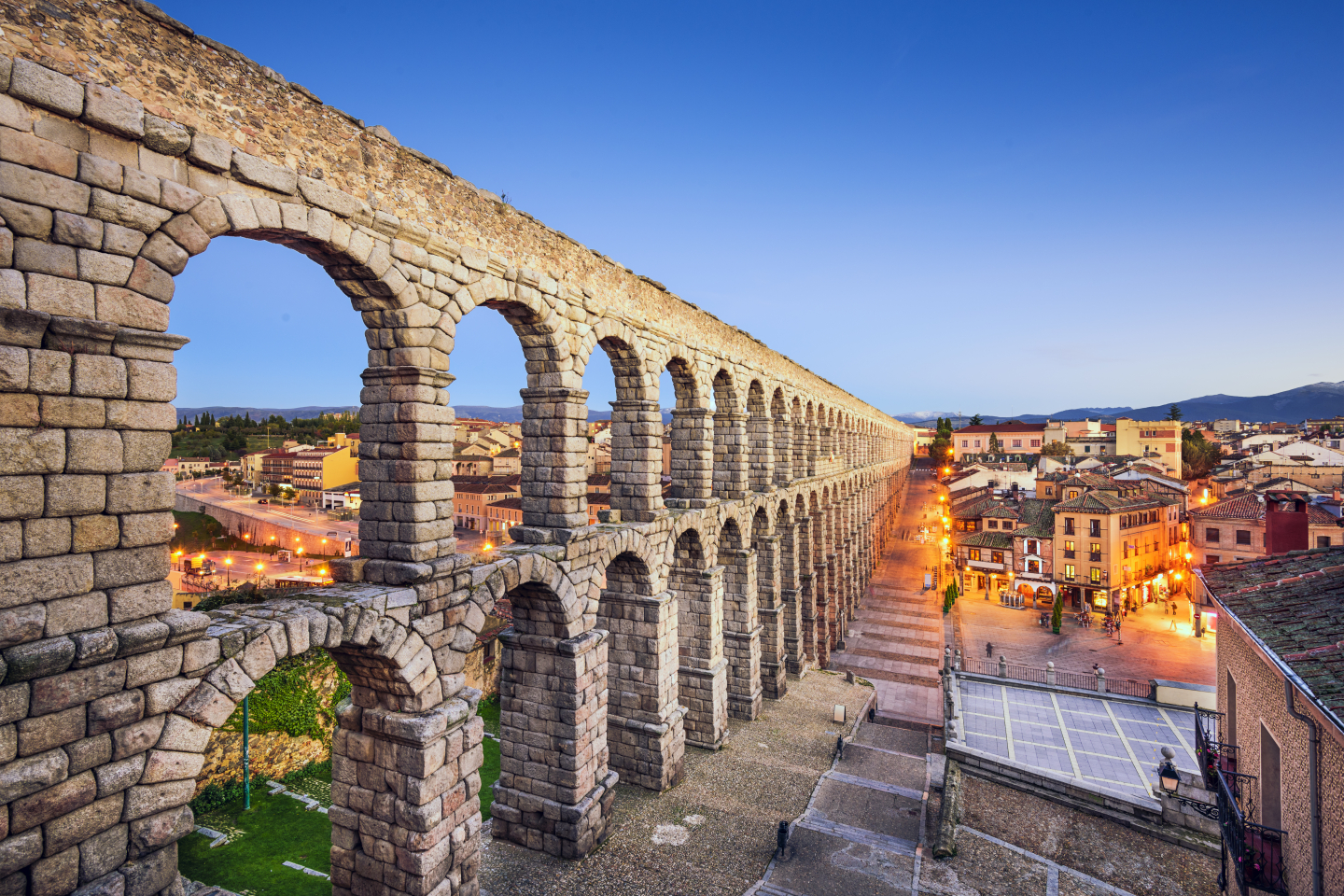 Sunset at the Aqueduct of Segovia, which was built by ancient Romans in Segovia, Spain