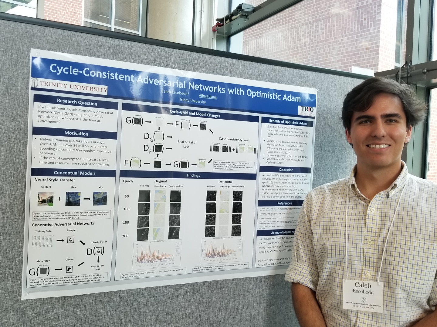 Student standing in front of poster presentation