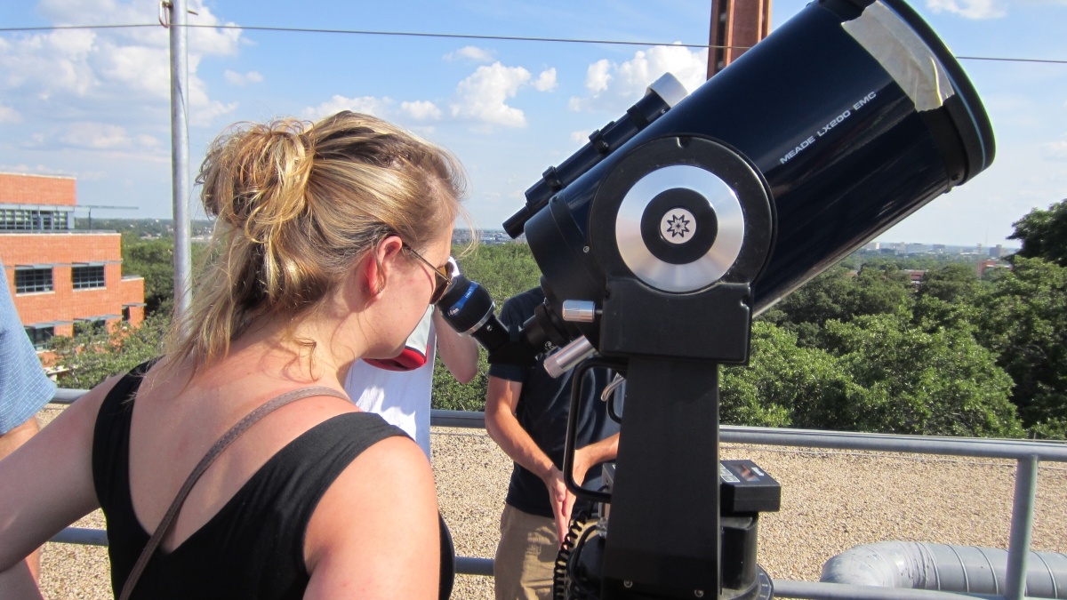 Students looking through a telescope