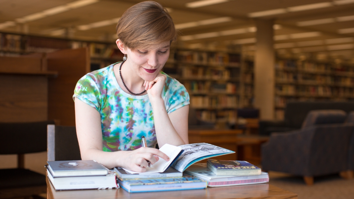 A student reads in the library