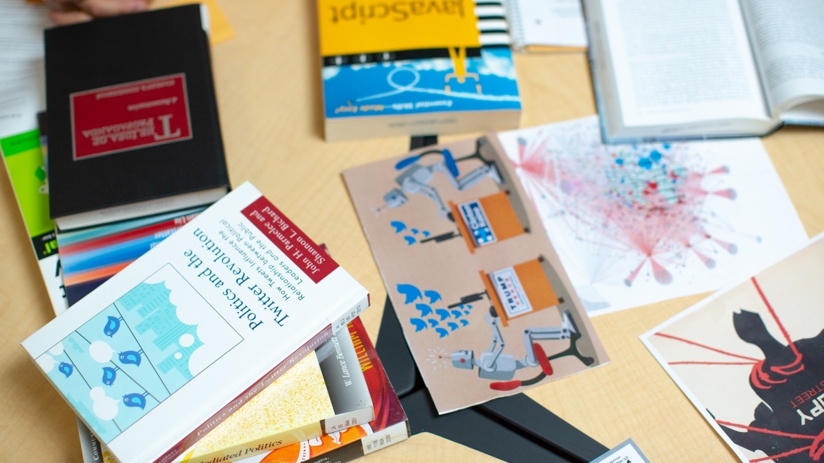 Desk covered in text books.