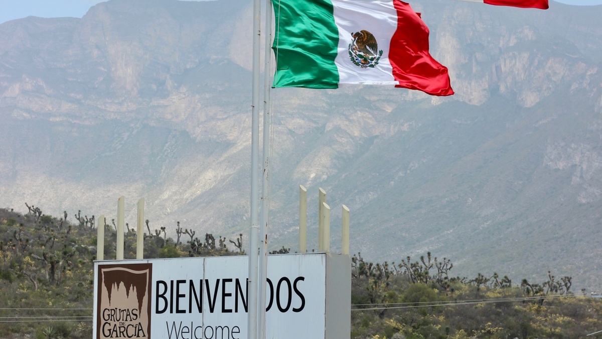 Two Mexican Flags mark the entrance to the city of nuevo leon