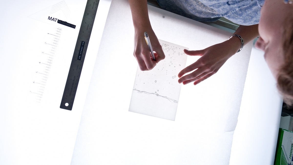 Hands Over a Light Box