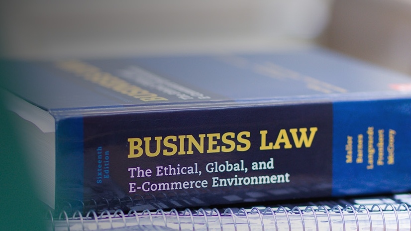 A business law book sits on a table