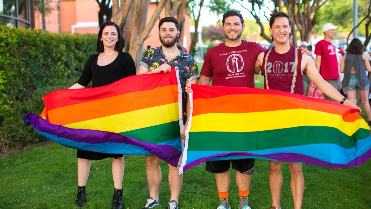 Group of students with a gay pride flag