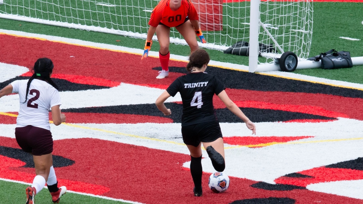 A Trinity soccer player in action